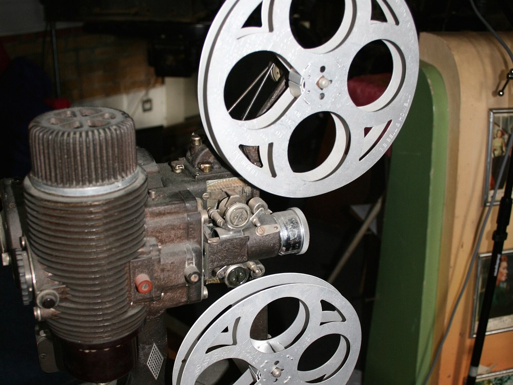 A 16mm film projector fitted with two metal reels