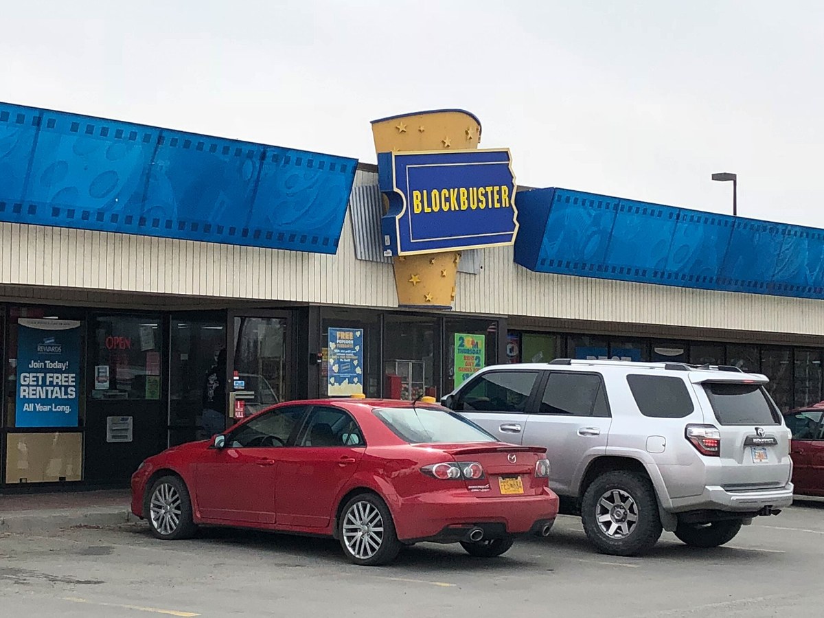 The exterior of a Blockbuster Video store with its blue and yellow sign
