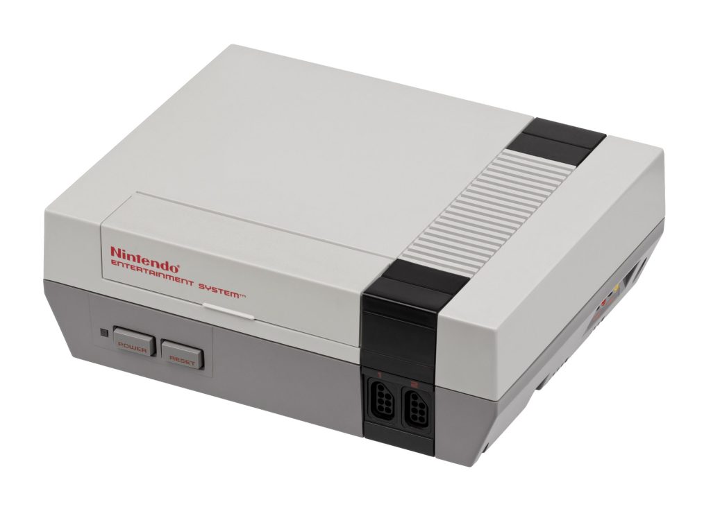 A gray Nintendo Entertainment System console with a flip-up cartridge door, red Nintendo lettering, power and reset buttons and two controller ports