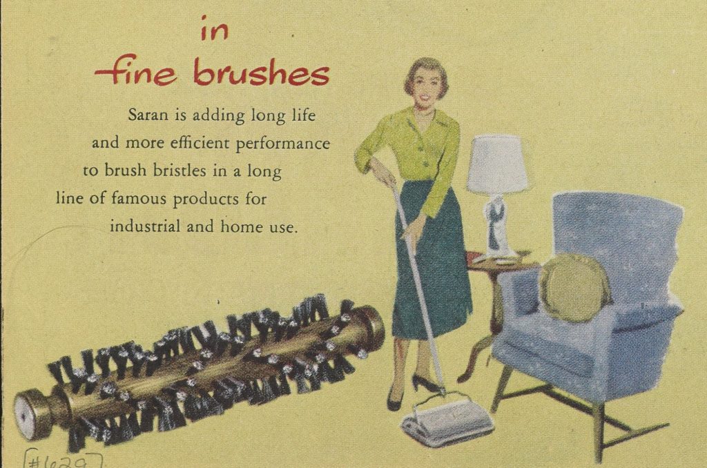 Illustration of a smiling woman pushing a carpet sweeper past an armchair, next to a large bristle brush roll
