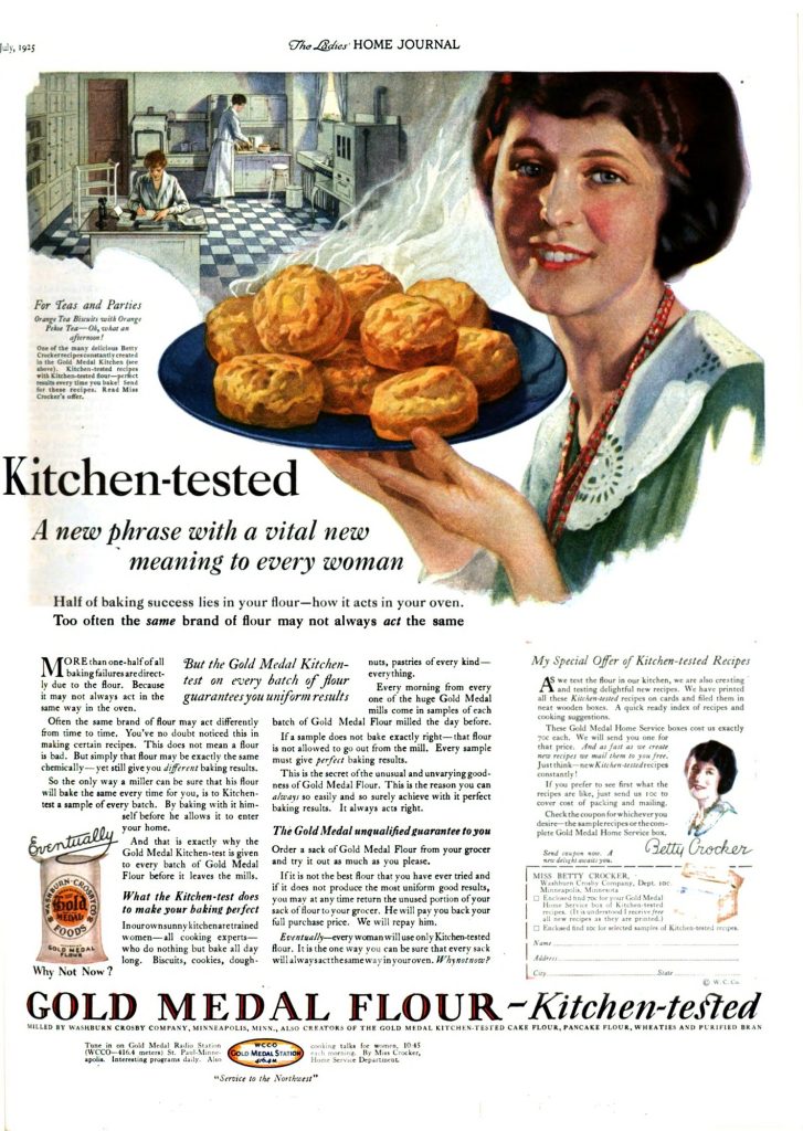 A 1925 Gold Medal Flour magazine ad: a smiling woman holds a plate of biscuits, and a coupon signed Betty Crocker offers kitchen-tested recipes printed on cards and filed in a wooden box.